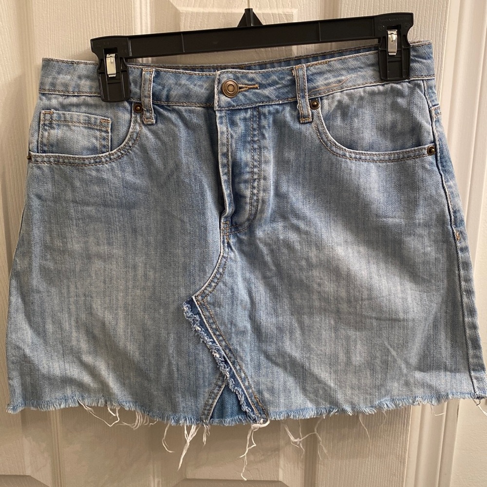 Distressed edge light wash high waisted jean skirt